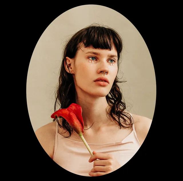 Portrait of a Woman with a Rose, photographic, minimal, warm