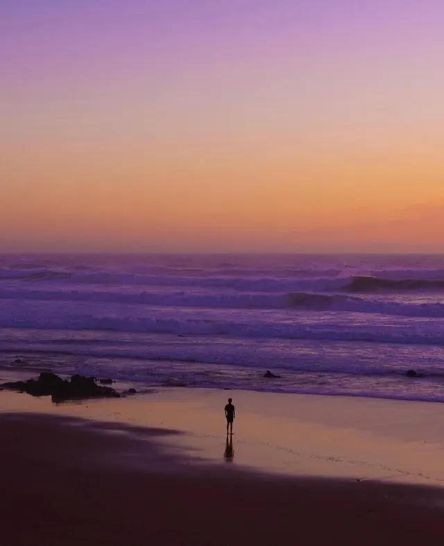 Silhouette on a Beach at Sunset, photographic, minimal, pastel