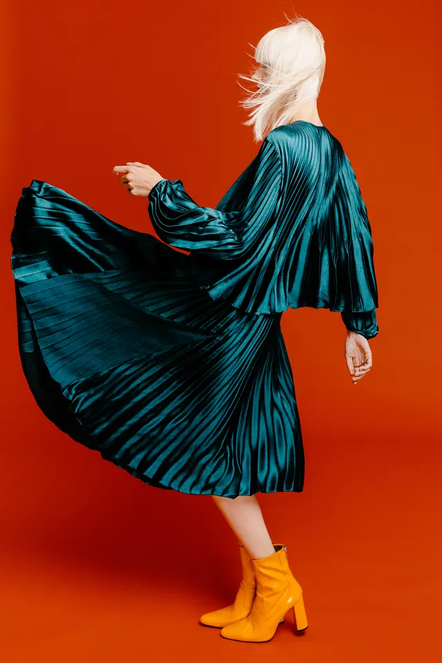 Woman in Teal Silk Dress and Orange Shoes, photographic, luxury, vibrant