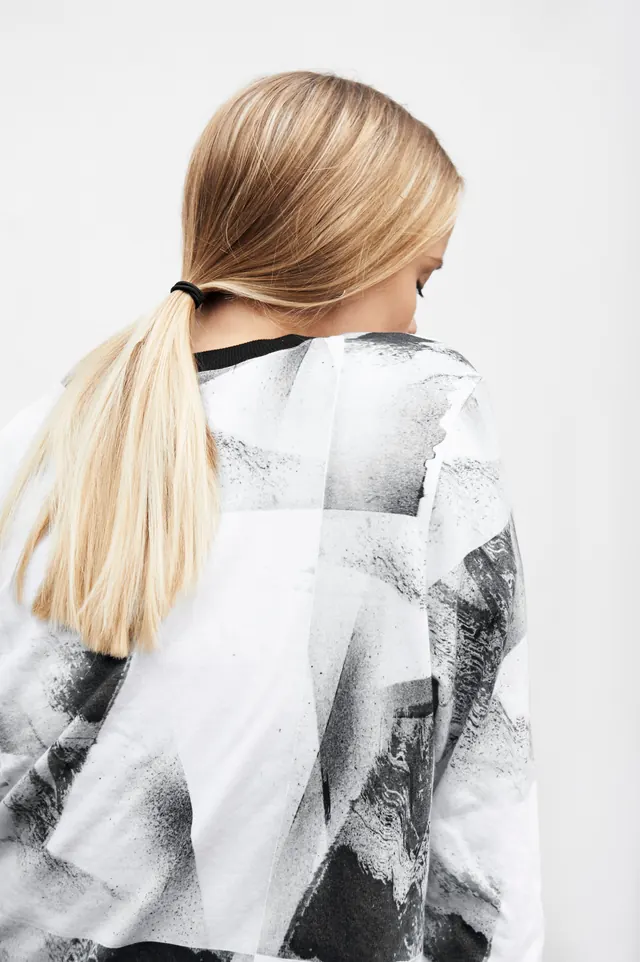 Woman in Abstract Patterned Coat, minimal, photographic, monochrome