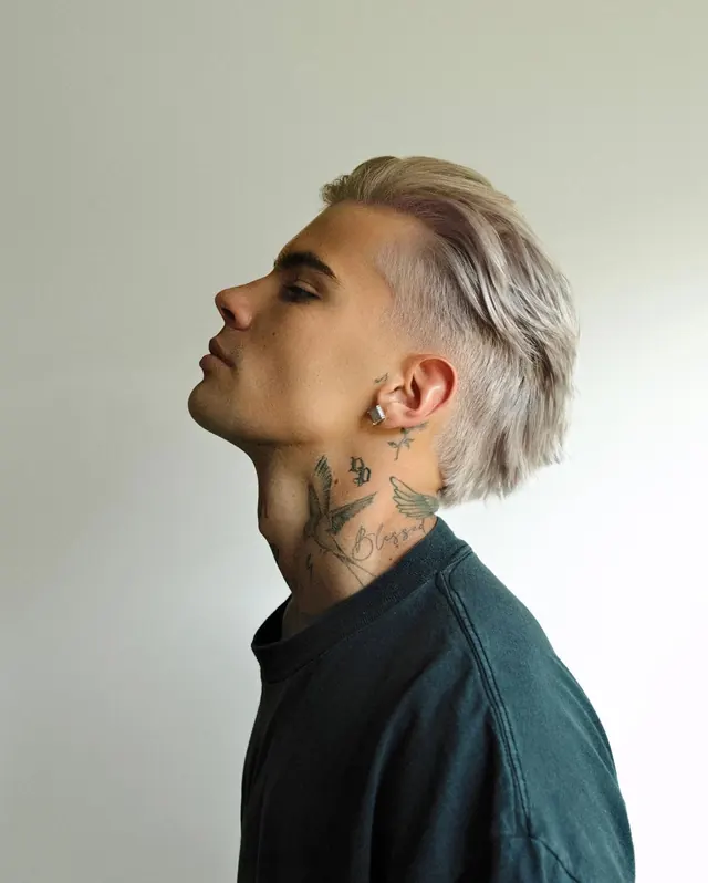 Portrait of a Man with Tattoos and Bleached Hair, photographic, minimal, light