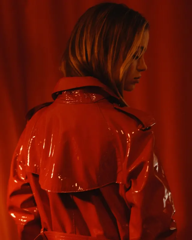 Woman in Red Glossy Jacket, photographic, luxury, vibrant