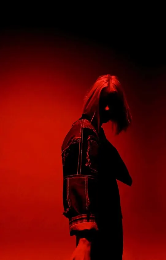 Red-Lit Portrait of a Person in a Jacket, dark-mode, photographic, dark