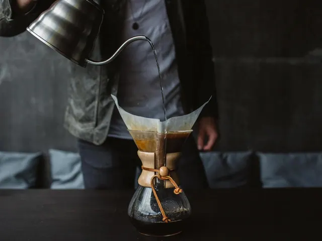 Pouring Coffee into a Glass Cup, photographic, minimal, dark