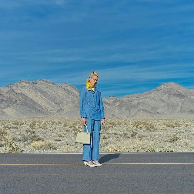Woman in Blue Suit in Desert, photographic, minimal, vibrant