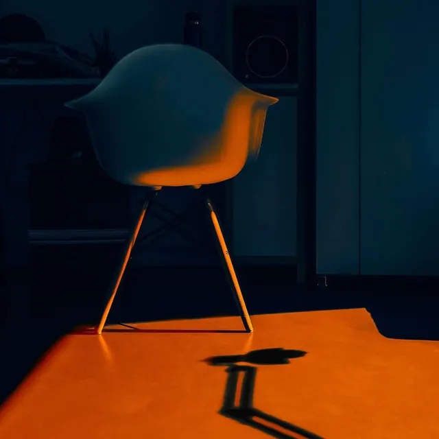 Modernist Chair in Dramatic Lighting, minimal, photographic, high-contrast