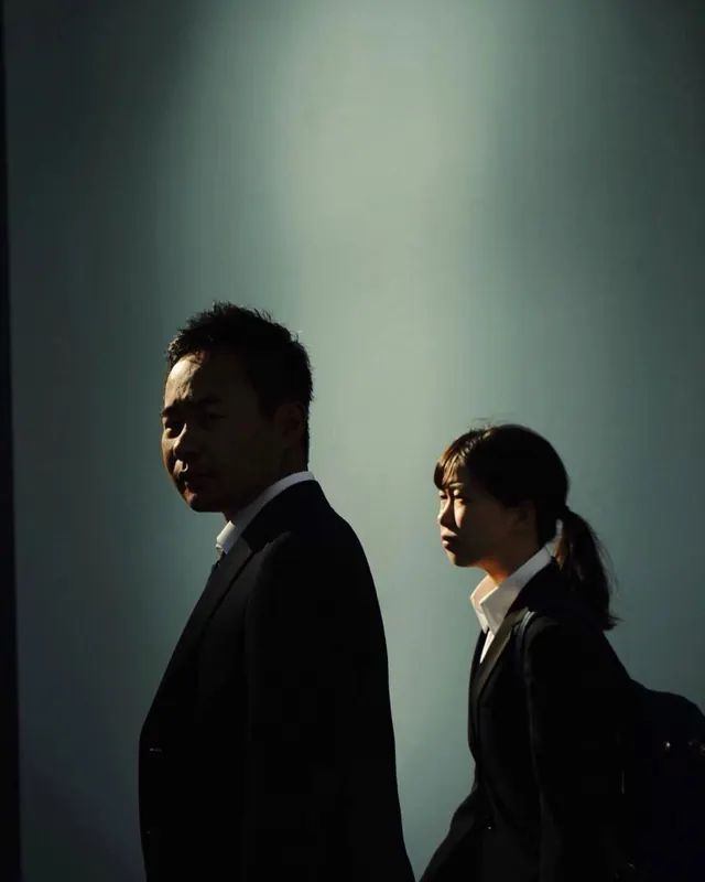 Professional Portrait of Two Individuals, minimal, photographic, dark