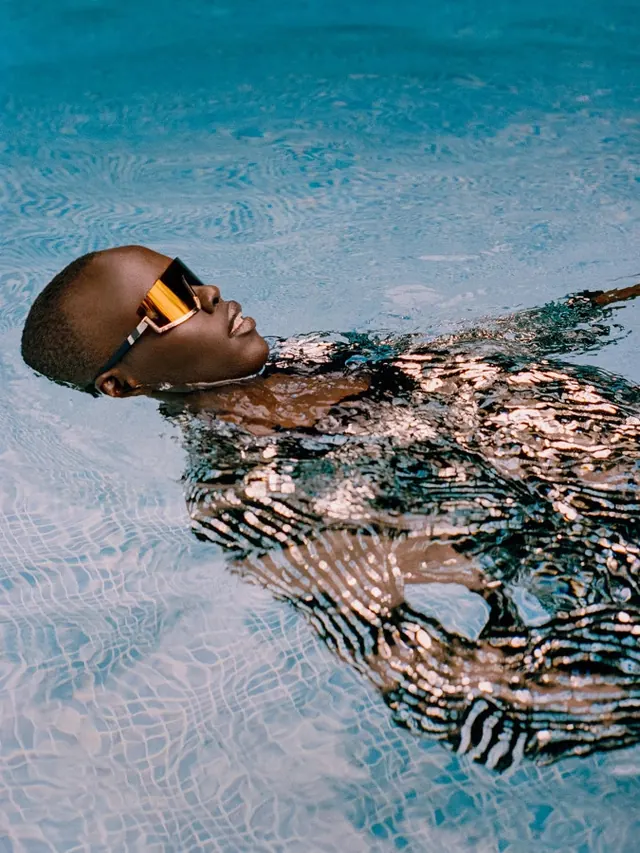 Man Floating in Swimming Pool, photographic, organic, cool