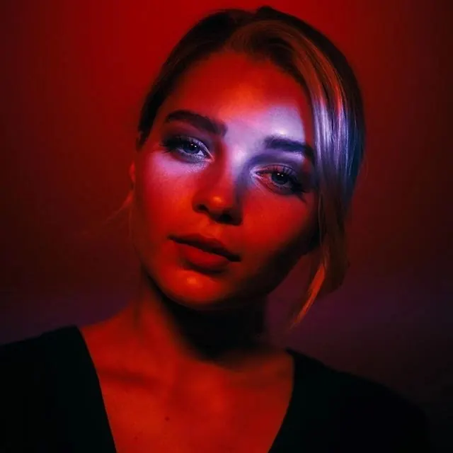 Portrait of a Woman in Neon Lighting, photographic, luxury, vibrant