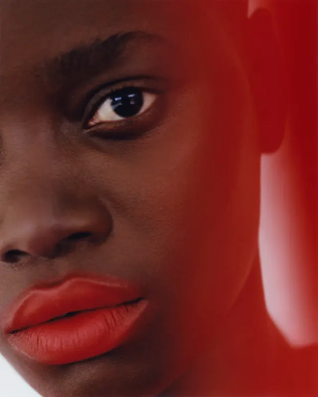 Close-up Portrait with Red Overlay, photographic, luxury, vibrant