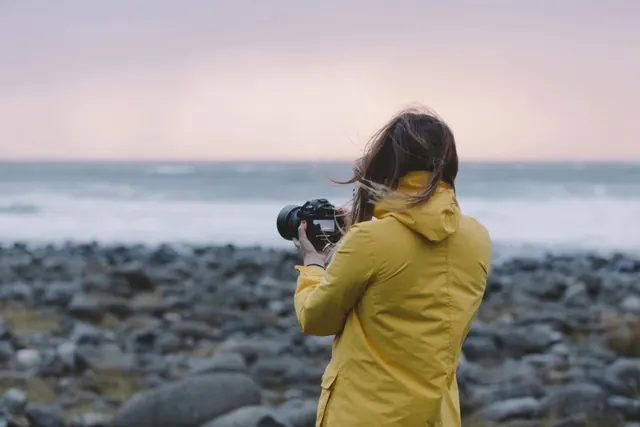 Woman in Yellow Raincoat on Beach, photographic, organic, muted