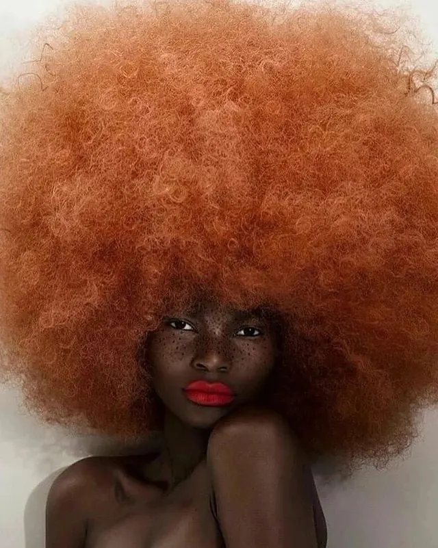 Woman with Voluminous Orange Afro, photographic, maximalist, vibrant