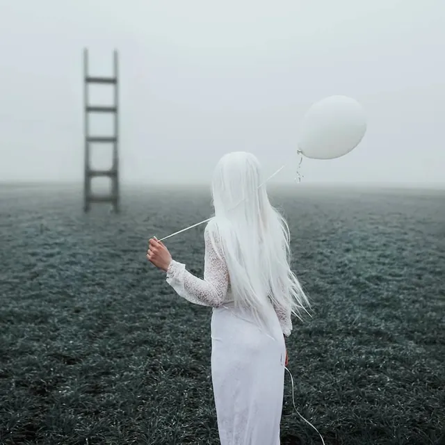Woman with Balloon in Foggy Field, minimal, photographic, monochrome
