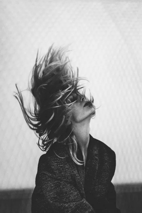 Monochrome Portrait of a Woman with Wind-Swept Hair, monochrome, photographic, monochrome