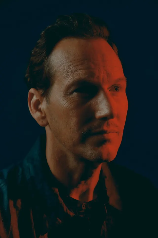 Portrait of a Man with Orange Lighting, photographic, dark-mode, dark
