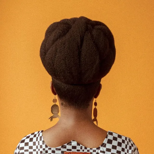 Woman with Braided Bun and Earrings, photographic, minimal, vibrant