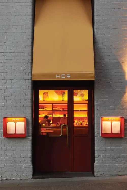 Storefront with Illuminated Signage, minimal, photographic, warm