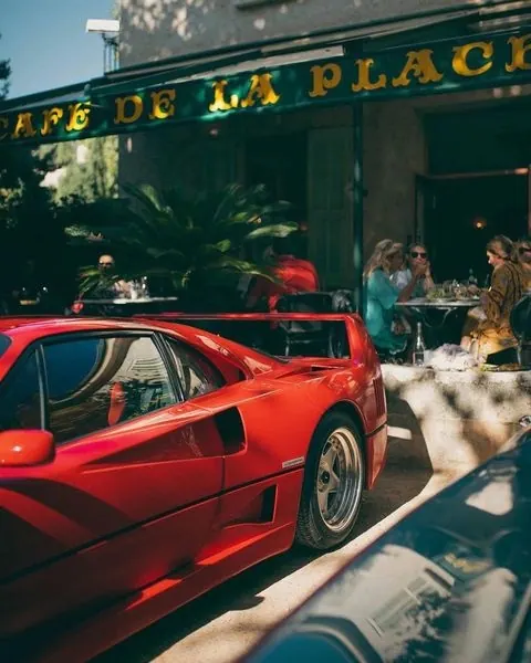 Red Sports Car in Front of Cafe, photographic, vibrant