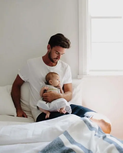 Father and Baby in Bed, photographic, minimal, light