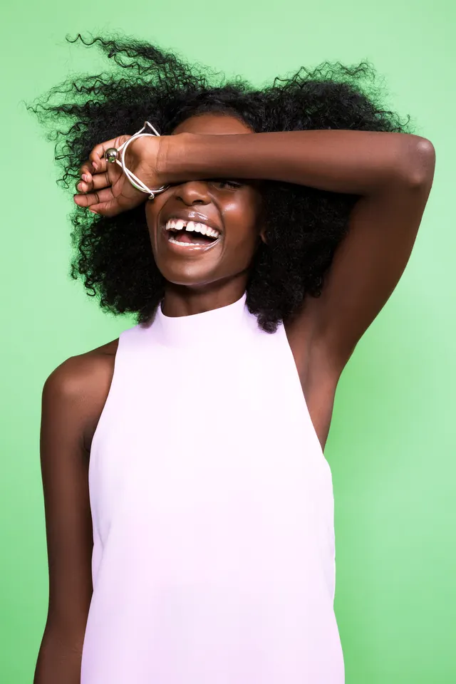 Smiling Woman in Pink Tank Top, photographic, organic, vibrant