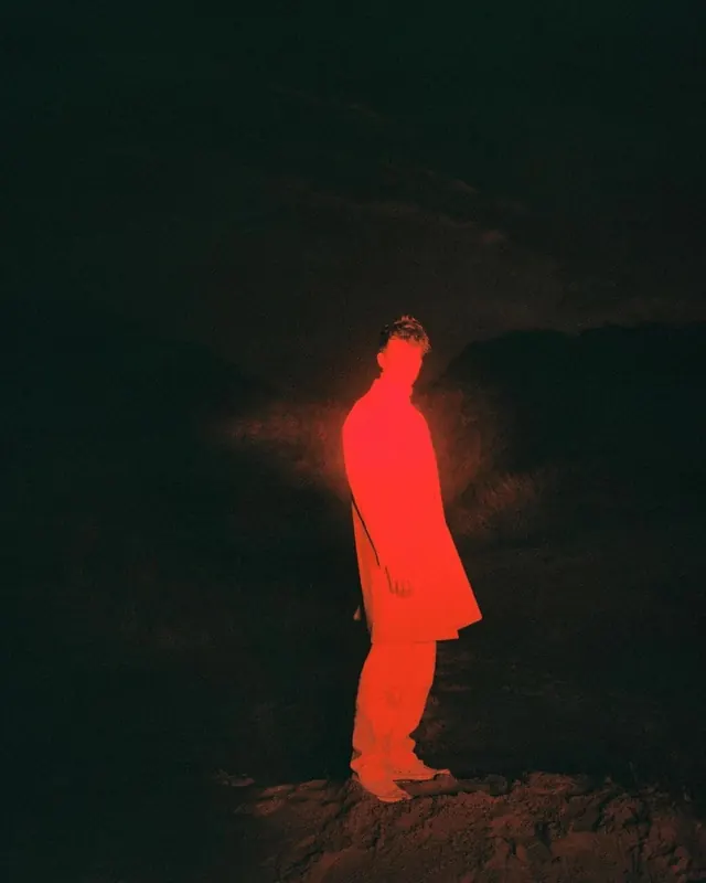 Glowing Figure in Darkness, minimal, photographic, dark