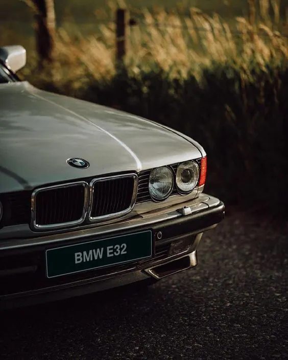 BMW E32 Vintage Car Close-up, photographic, luxury, muted