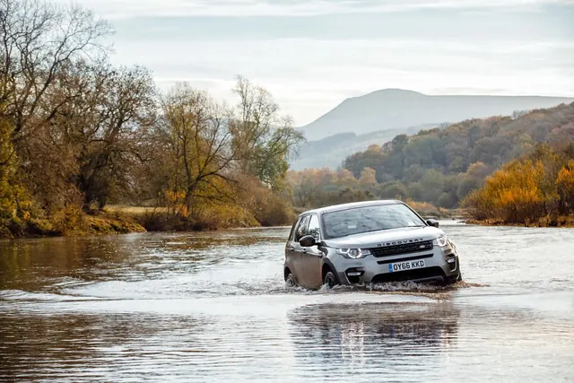 Car Driving Through Flood Water, photographic, organic, muted