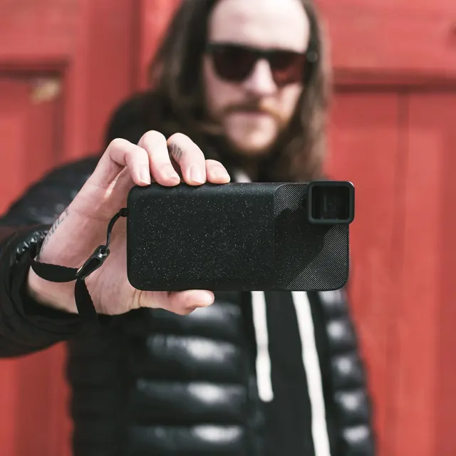 Smartphone Mockup with Person, photographic, minimal, dark