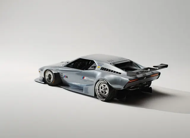 Wide-body BMW M1 race car render, technical, minimal, light