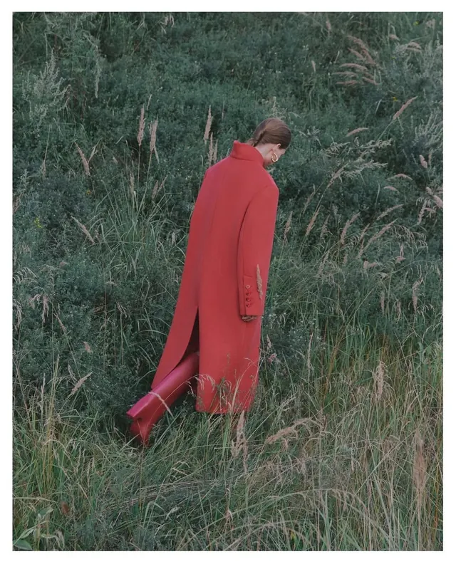 Man in Red Coat in Tall Grass, photographic, organic, high-contrast