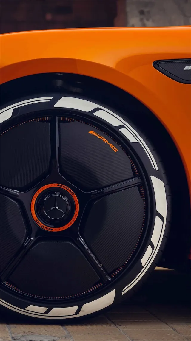 Orange Car Wheel Close-up, photographic, technical, vibrant