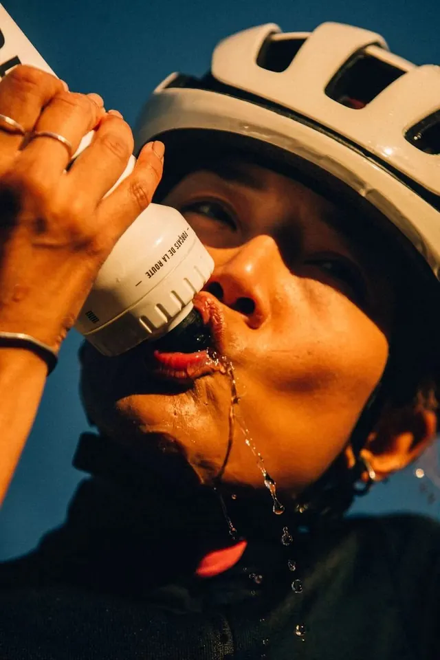 Cyclist with Water Bottle, photographic, organic, vibrant