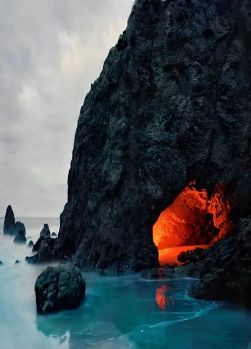Glowing Cave in Coastal Cliffs, photographic, organic, dark