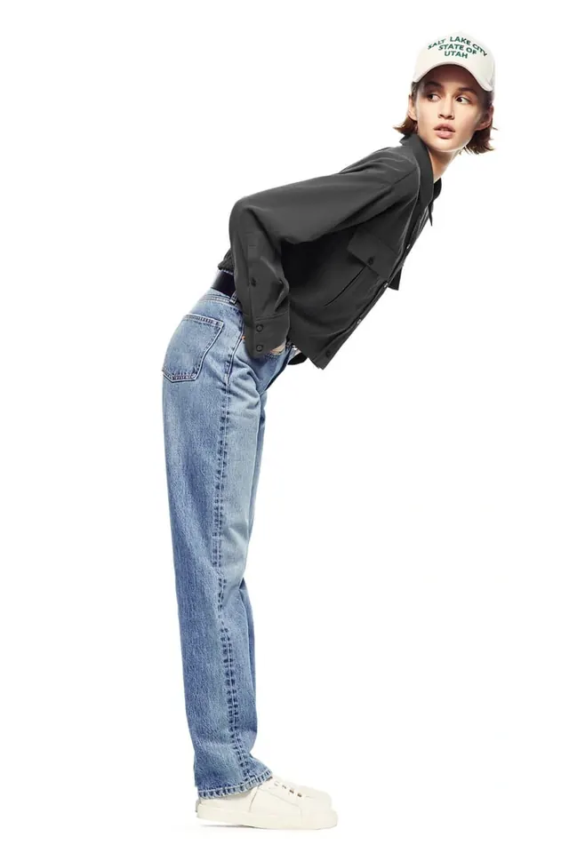 Woman in Black Top and Jeans, minimal, photographic, high-contrast