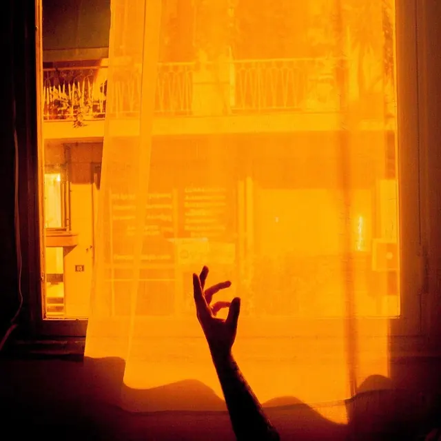 Hand Reaching Through Orange Curtain, photographic, abstract, warm