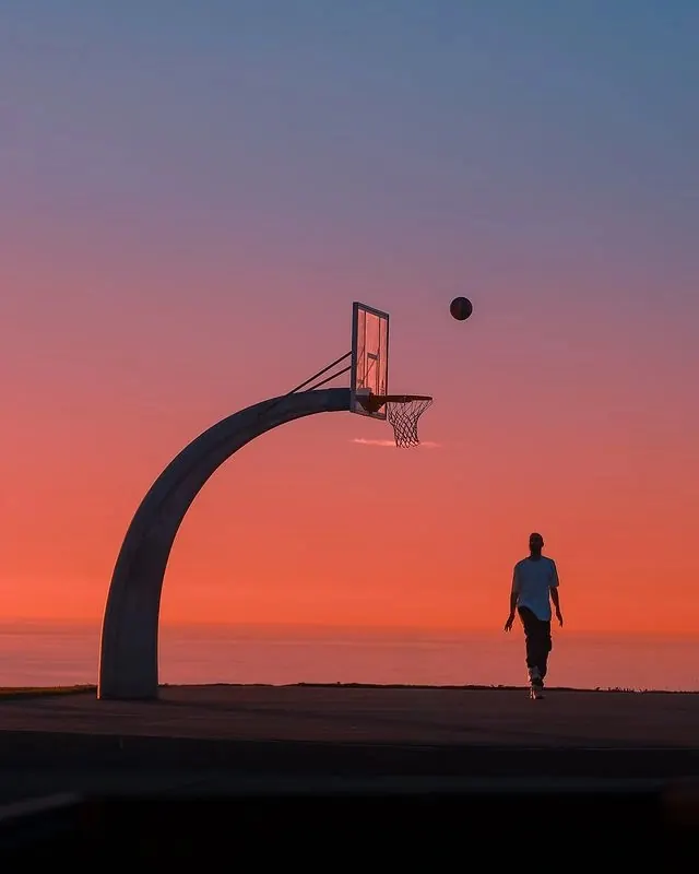 Basketball Player Silhouette at Sunset, minimal, photographic, vibrant