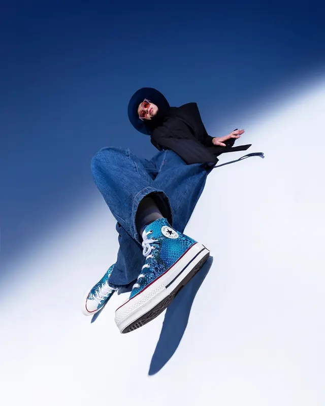 Skater in Blue Jeans and Hoodie, photographic, minimal, cool