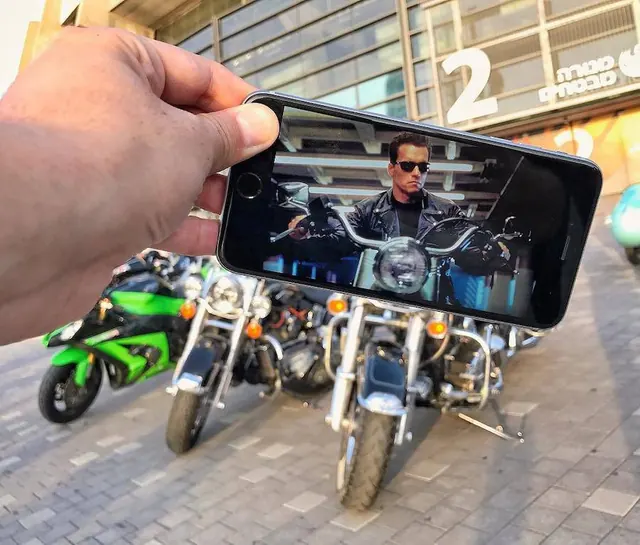 Smartphone Mockup with Motorcycle Imagery, photographic, dark-mode, dark