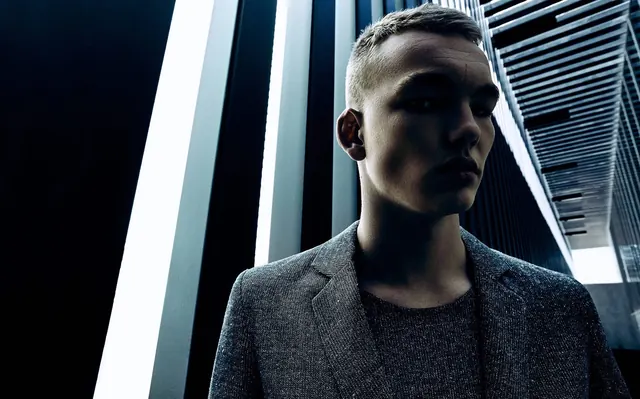 Portrait of a Man in a Suit, minimal, dark-mode, dark