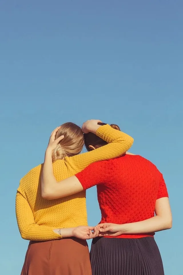 Two Women in Vibrant Knitwear, minimal, photographic, vibrant