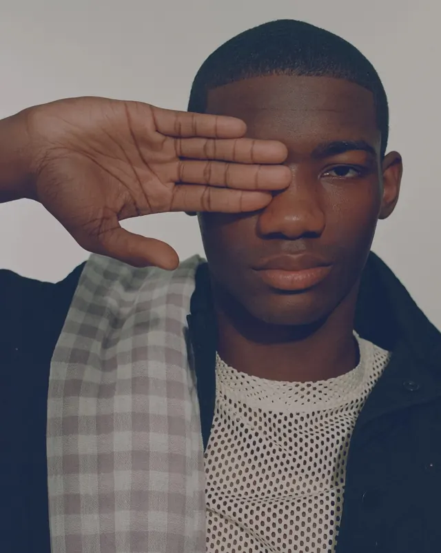 Portrait of a Man with Hand Over Eye, photographic, minimal, high-contrast