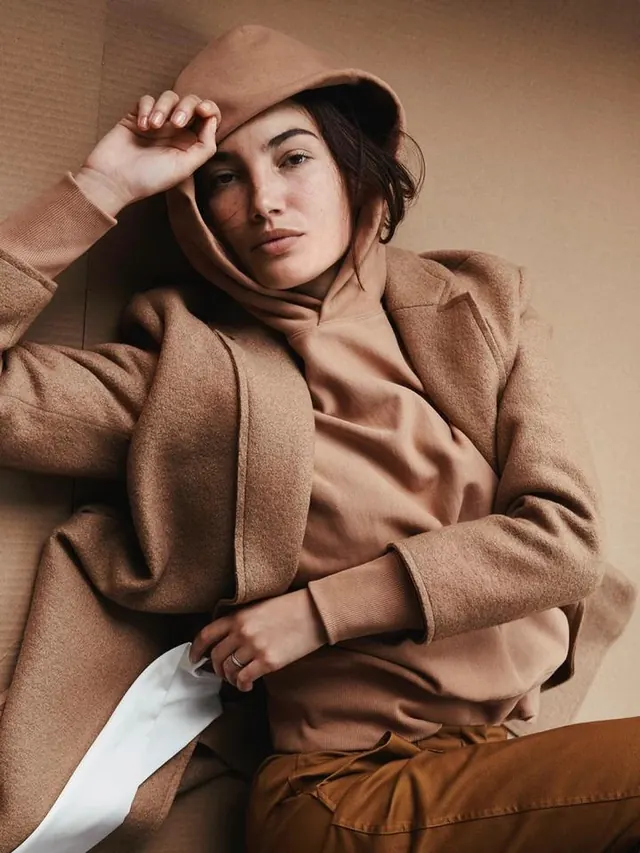 Fashion Portrait of Woman in Oversized Coat, photographic, luxury, muted