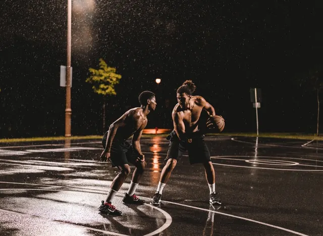 Basketball Players in Rain, photographic, dark-mode, dark