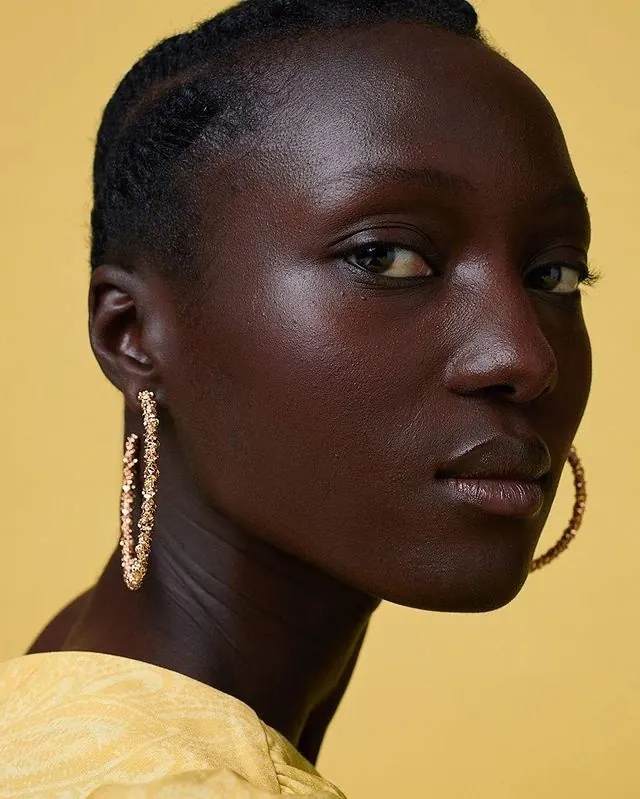 Portrait of a Woman with Gold Earrings, photographic, luxury, vibrant