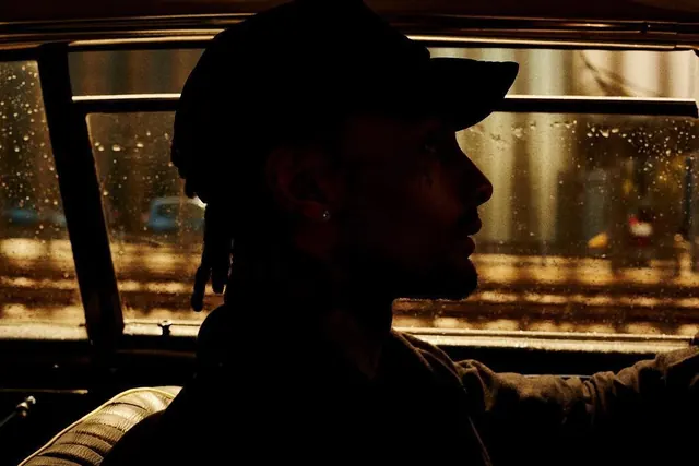 Man in Hat in Rain, photographic, dark-mode, dark