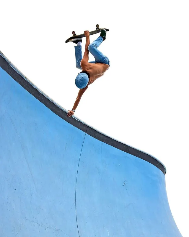 Skater on a Blue Ramp, photographic, minimal, vibrant