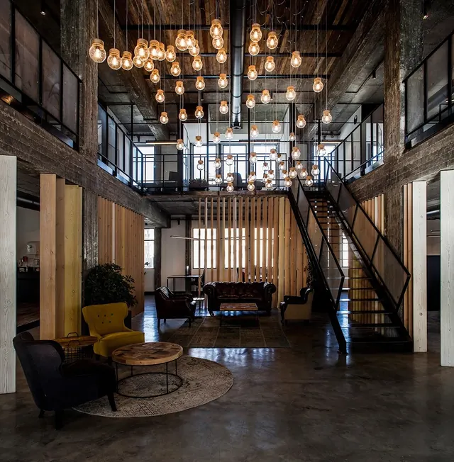 Industrial Loft Interior with Exposed Brick and Wood, photographic, warm