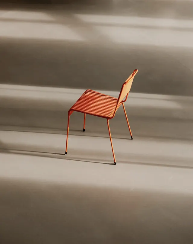 Minimalist Orange Chair in Shadow, minimal, photographic, warm