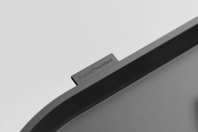 Wordmark on Hardware Mockup, minimal, corporate-clean, dark