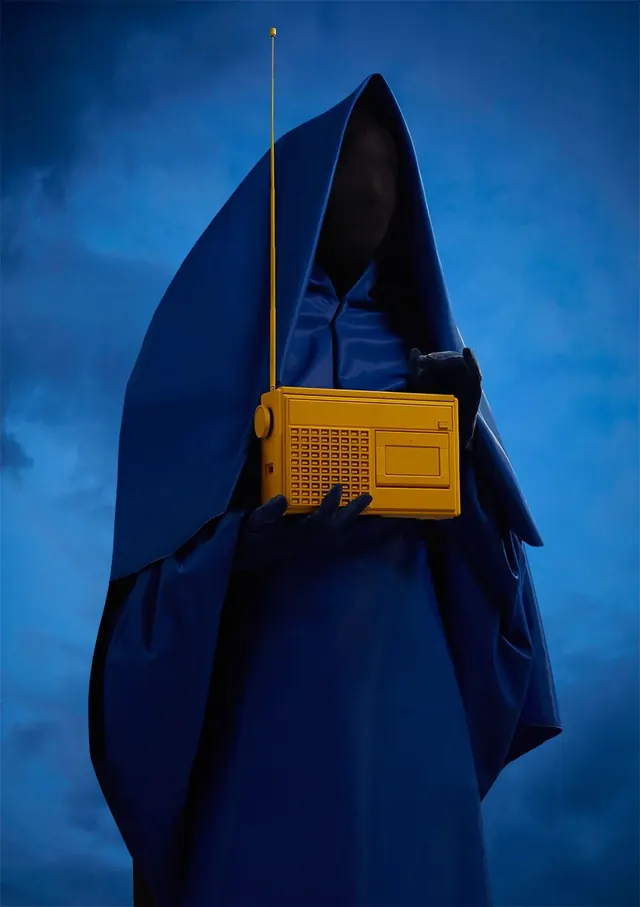 Hooded Figure with Radio, photographic, dark-mode, dark